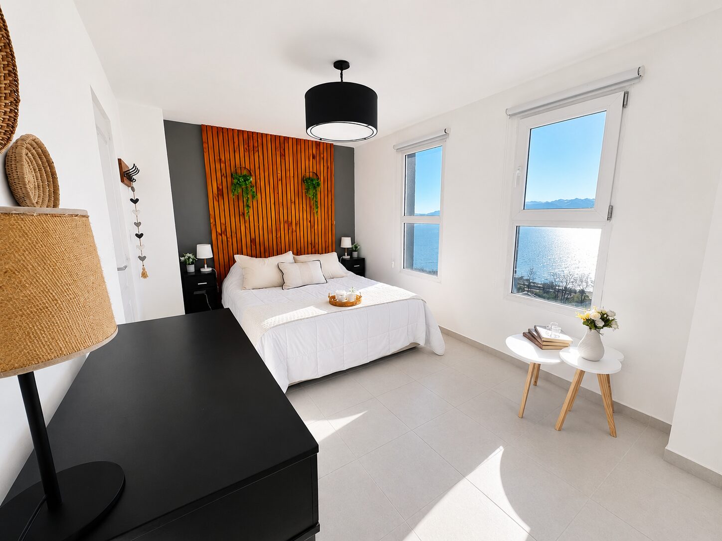Dormitorio con vista al lago en Boutique Suite Bariloche